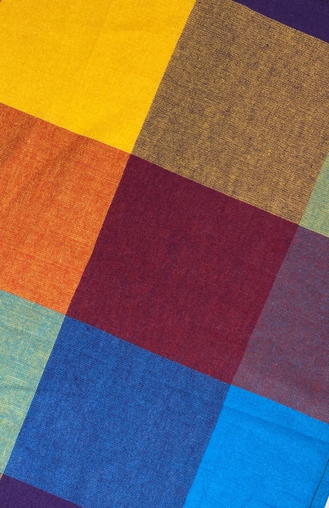Close up image of rainbow/multicolor checked cloth napkin sold as a set of two, quick drying,  handmade in Nepal. 
