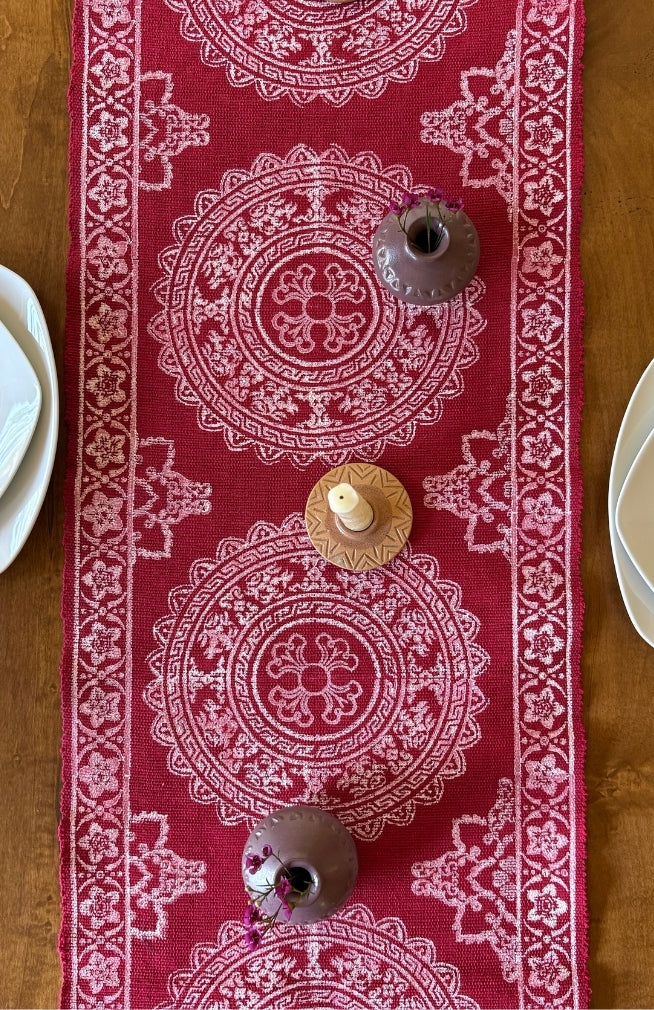 red cotton table runner with white blockprinted design