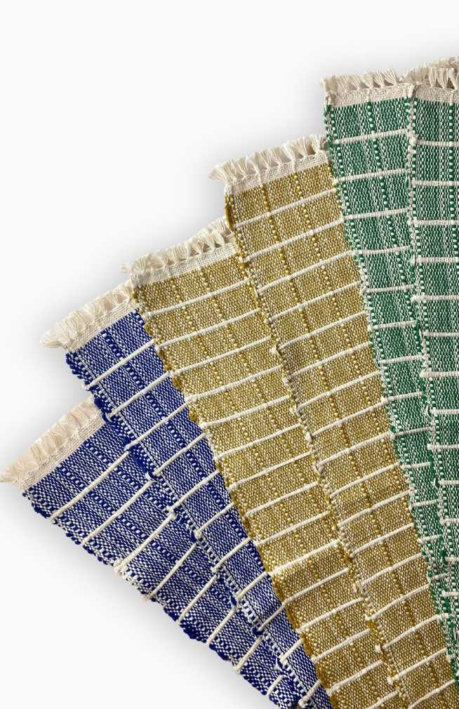 Handwoven ribbed cotton placemat with subtle square design available in assorted colors. Handmade in Nepal.