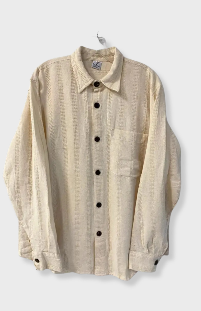 A fair trade, cream-colored textured long-sleeve button-up shirt with a collar and chest pocket