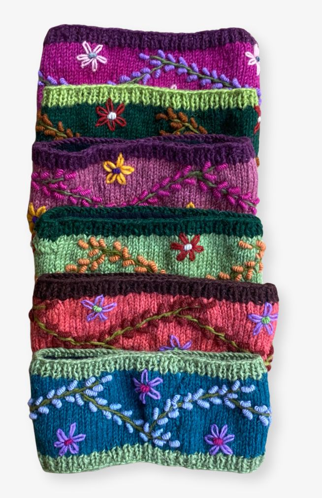 Handmade wool knit headbands with vine embroidery. Made my artisans in Nepal. 
