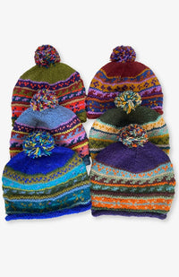 Assorted colors of handmade wool knit stocking caps with fleece lining. Handmade by artisans in Nepal.