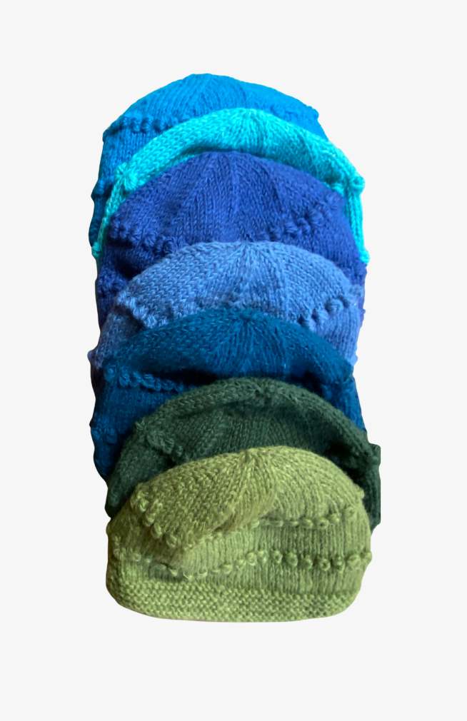 assorted hand knit wool hats in solid blues and greens with fleece lining, fair trade Nepal