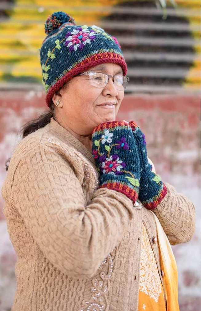 Hand made winter hat with flower embroidery design and pom pom, certified fair trade