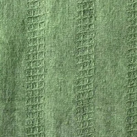 close up of green textured cotton