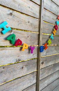A colorful 'HAPPY BIRTHDAY' felt letter garland. Fair trade and handmade in Nepal.