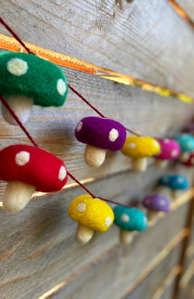 Handmade colorful felt mushroom garland. Fair trade Nepal.
