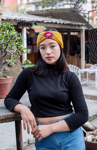 wool knit headband with flower embroidery from nepal jewel tones gorgeous feminine bow shape