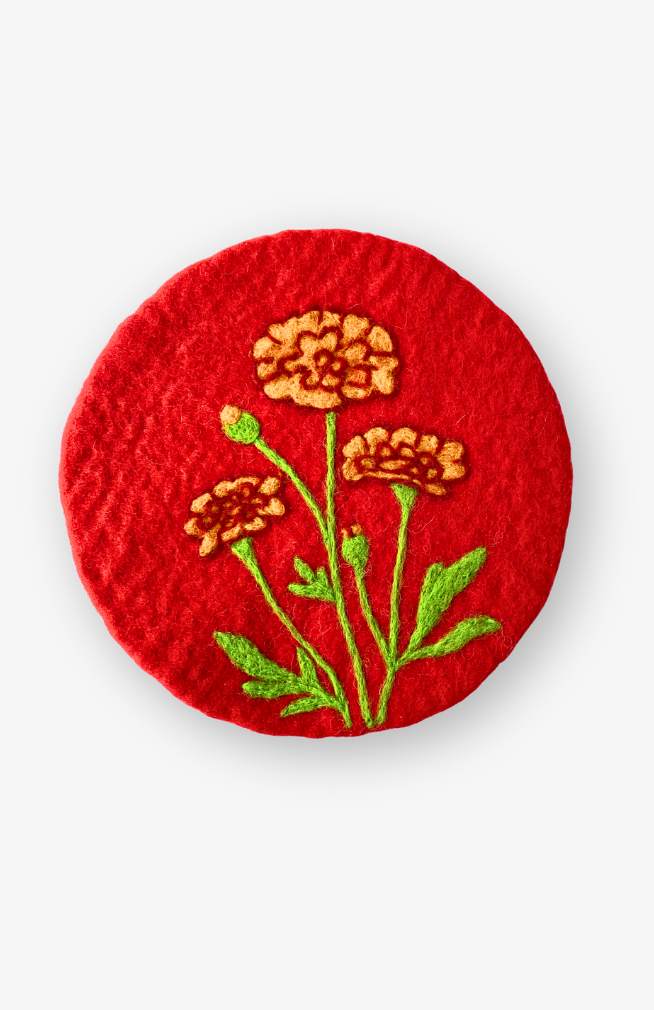 Felt trivet, orange marigold on red background, October flower of the month
