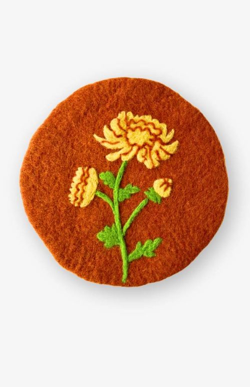 Felt flower of the month trivet, November chrysanthemum on tan background