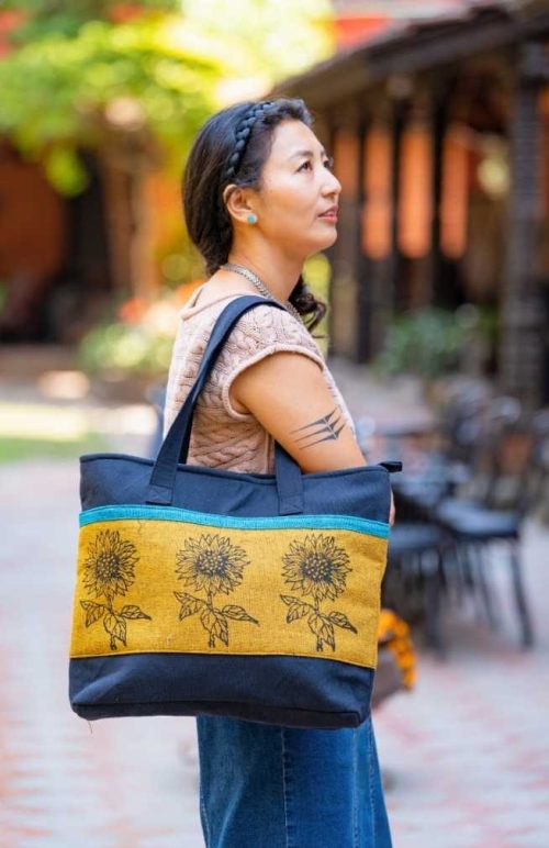 cotton block print tote bag with two front pockets, zippered top and inside zippered pocket