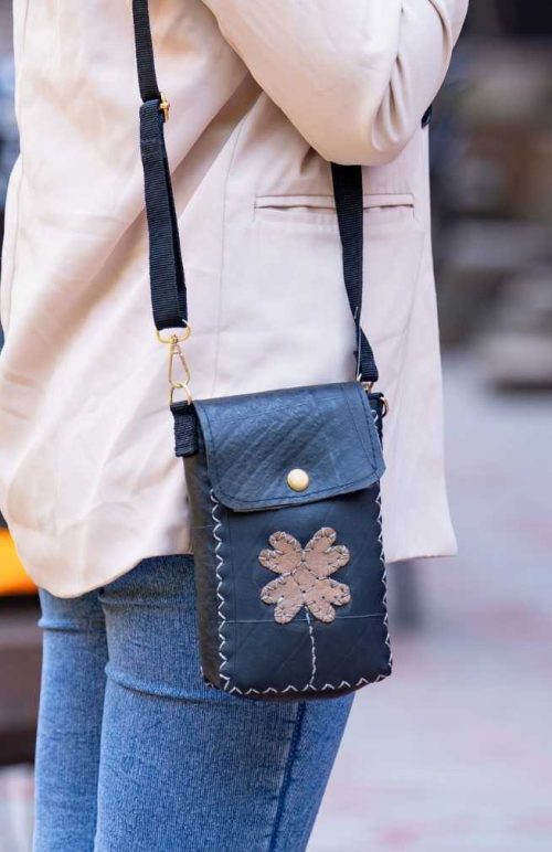 recycled rubber cross body bag with front flap and snap closure