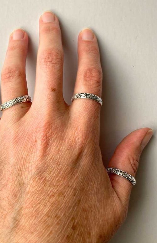 handmade sterling silver band ring 8 auspicious symbols fair trade Nepal