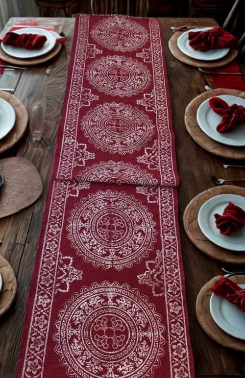 red cotton table runner with white blockprinted design