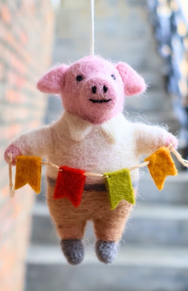 hand felted pig with flag banner ornament