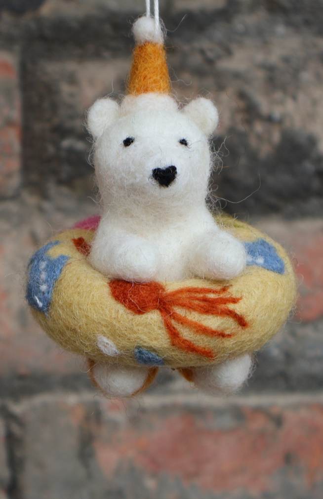 hand felted polar bear Christmas ornament with ocean-inspired floatie ring around its middle
