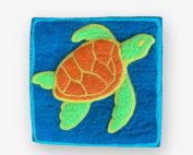 hand felted square sea turtle trivet with teal background