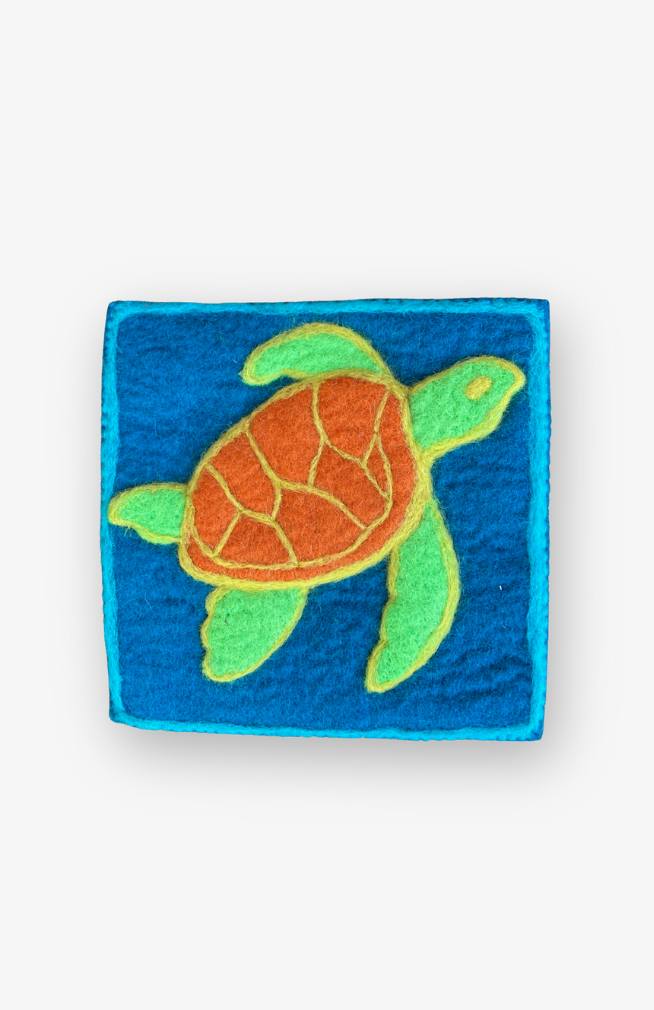 hand felted square sea turtle trivet with teal background